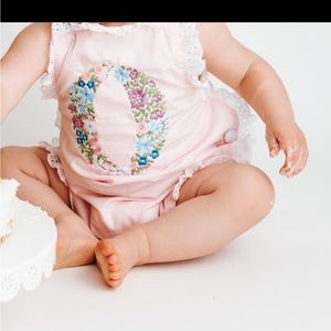 Floral “o” embroidered sun suit